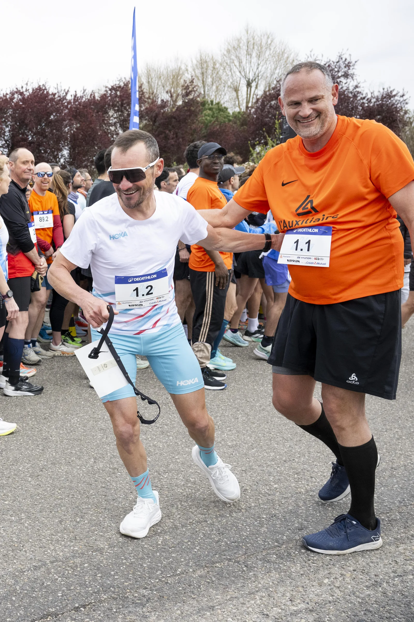 Passage de relais entre coureurs lors de l’Ekiden entreprises FOR7